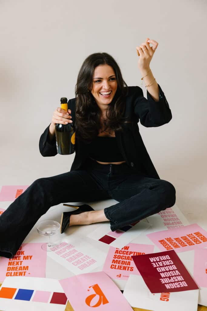 Copyright Chiara Hammerer. Woman celebrating with champagne at event.